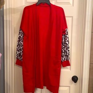 Red cardigan with animal print sleeves